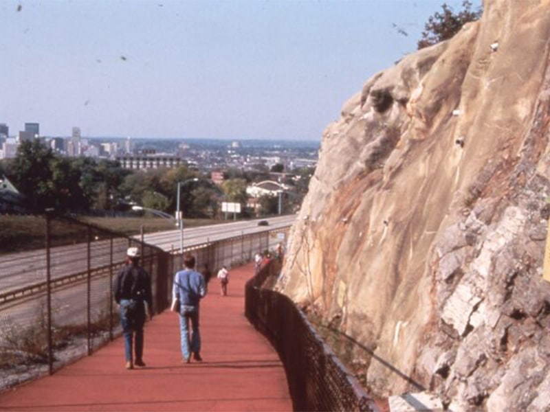 a group of people standing on top of a mountain