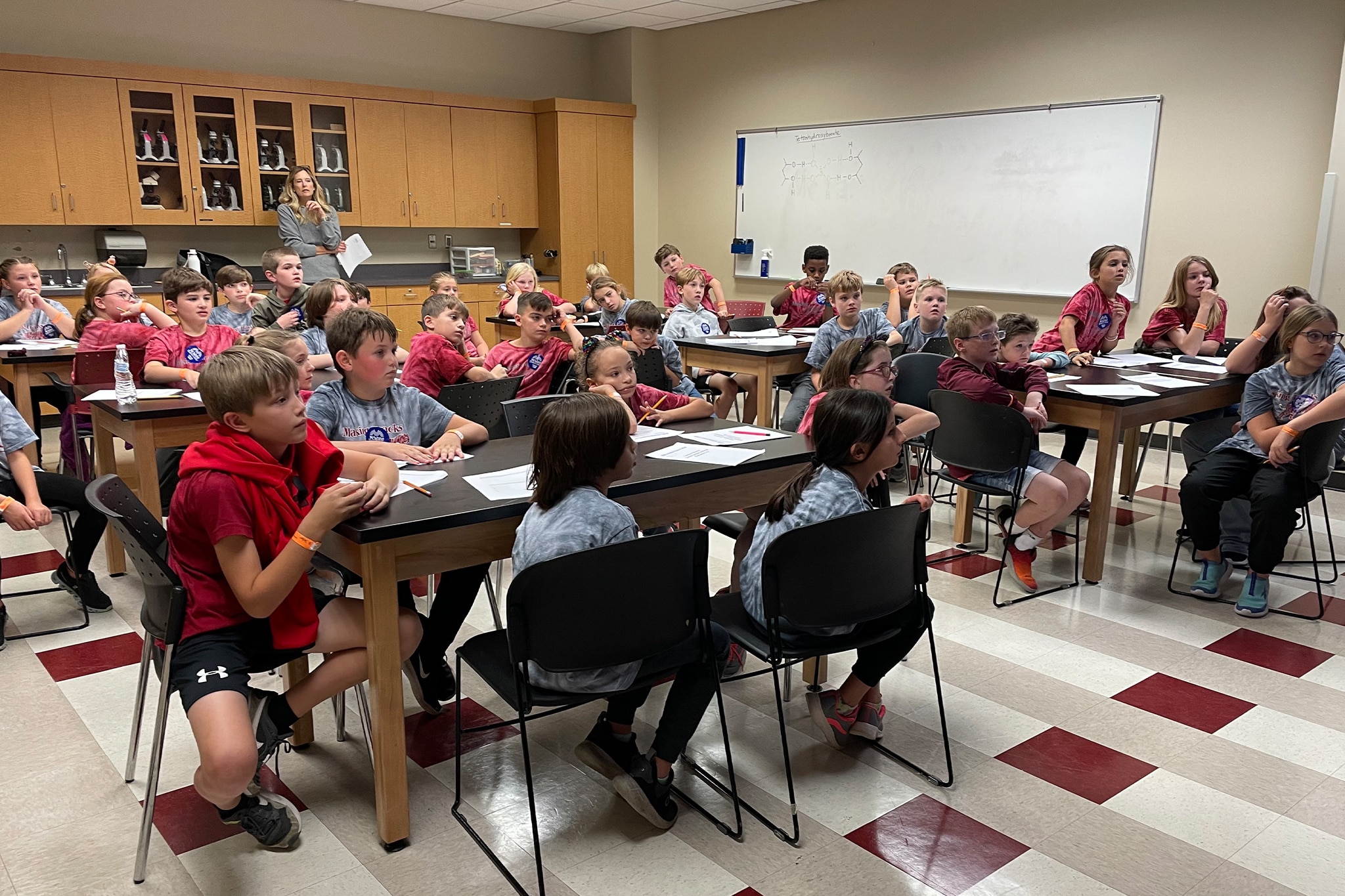 a group of people sitting at a table in a room